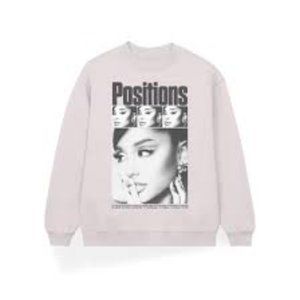 Ariana Grande positions sweater